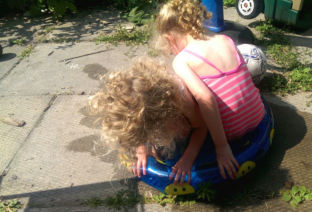 The girls taking a dip in our pool.